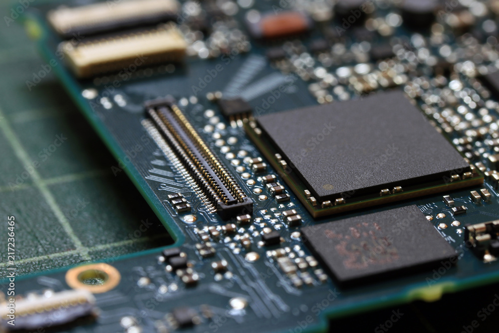 Electronics background technology close up of the green kit circuit board. Application Specific Integrated Circuit.. Electronics background technology close up of the green kit circuit board. Application Specific Integrated Circuit..