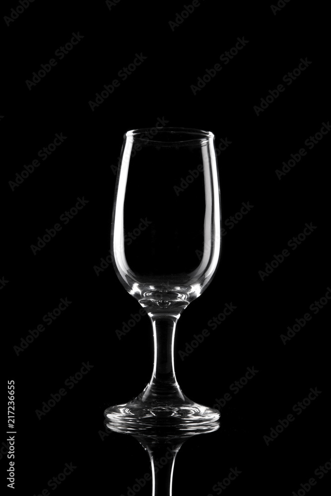 transparent wine glass on the black