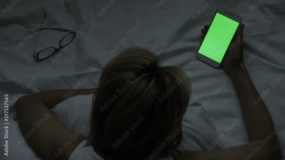 Middle-aged female having eyes problems, dozing off, flipping through networks Middle-aged female having eyes problems, dozing off, flipping through networks