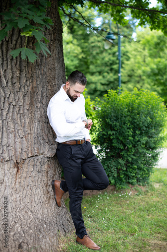 Portrait Of A Confident Businessman Outside In Park