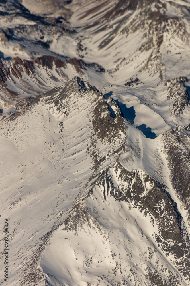Fototapeta premium Aerial view of snow covered Sierra Nevada in California
