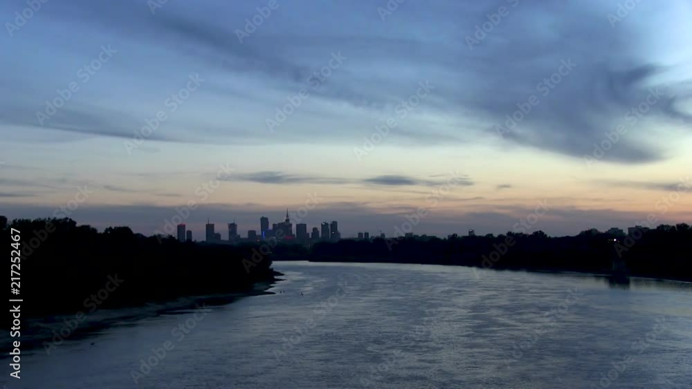 A view of Warsaw skyline from Siekierkowski Bridge at dusk. A view of Warsaw skyline from Siekierkowski Bridge at dusk.
