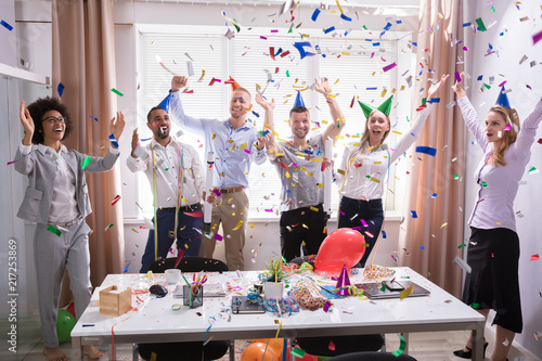 Excited Businesspeople Having Fun Raising Their Arms photo