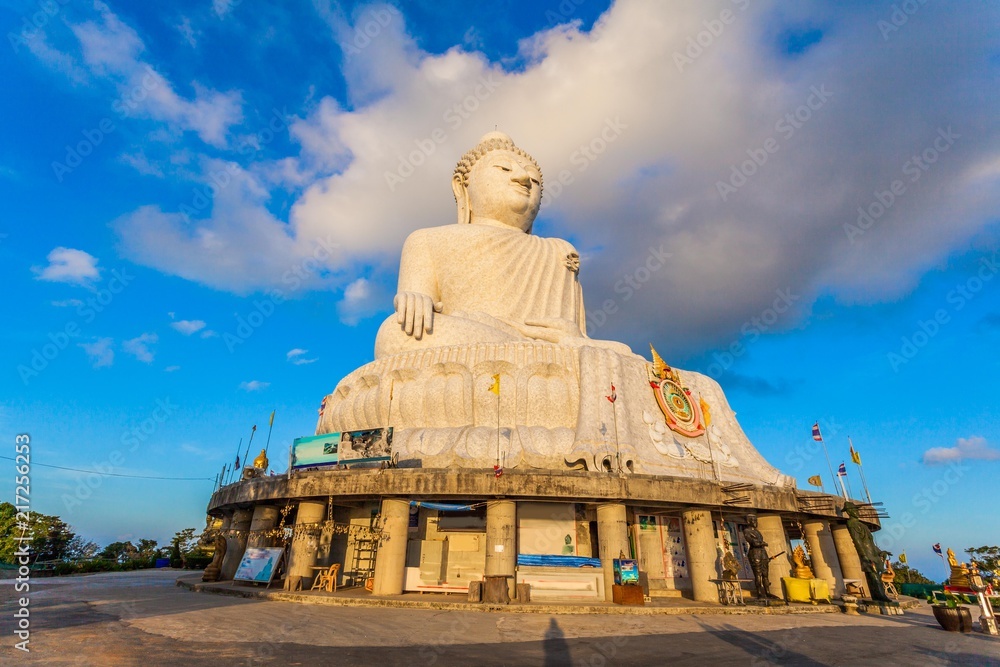 Fototapeta premium Phuket big Buddha in blue sky. locate of Phuket big Buddha viewpoint on the high mountain can see around Phuket island.stuning sunrise in Chalong gulf