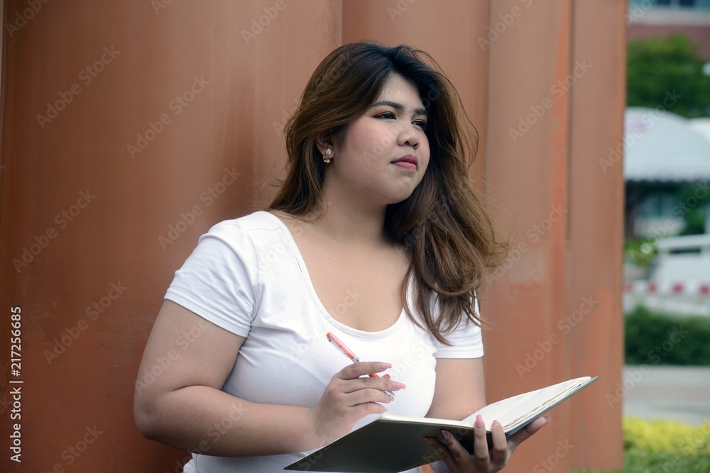 Portrait of Asian pretty smiley face fat woman pose and thinking on group of pole in the park. (15 of 18).jpg Portrait of Asian pretty smiley face fat woman pose and thinking on group of pole in the park. (15 of 18).jpg