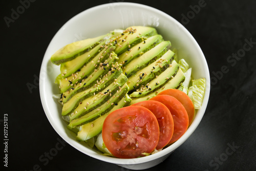 Close shot of salad in a white bowl