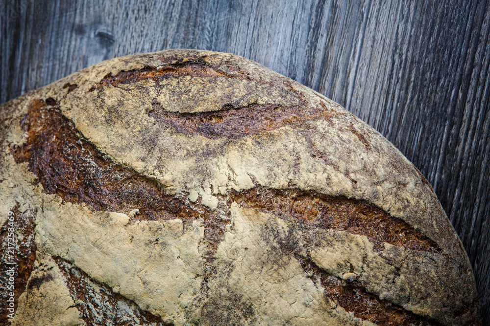 closeup big whole handmade round black bread closeup big whole handmade round black bread