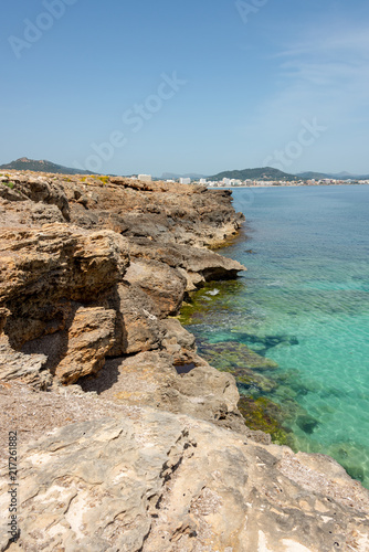 View over the clear turquoise waters of the Mediterranean to the beach of Cala Millor on the Spanish Mediterranean island Mallocra