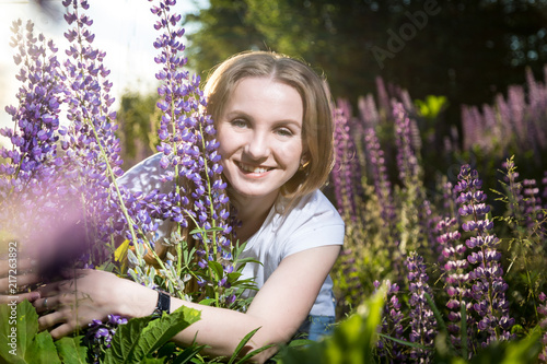 Girl in a field of purple lupines