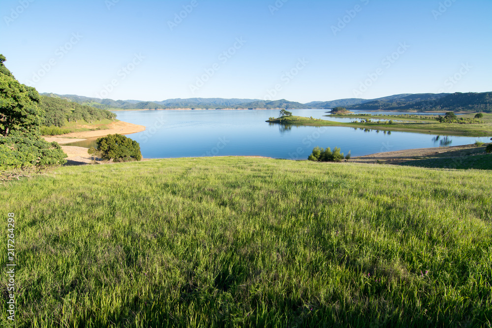 Picturesque lake in valley with mountains Picturesque lake in valley with mountains