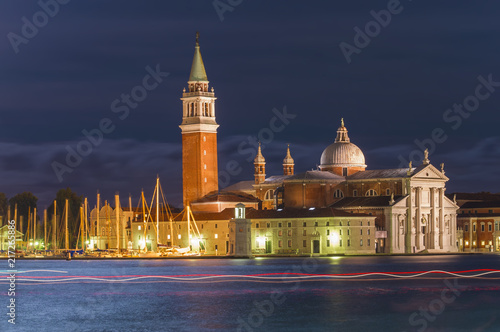 Venice city at night. long exposure with light trails from boat