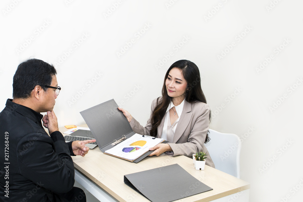 Manager businessman talking with businesswoman  on office.Their are smiling.Copy space.