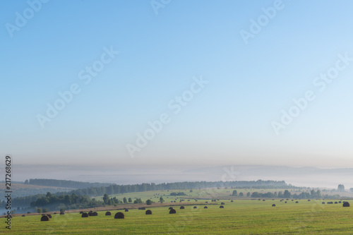 panoramic view of green hills against blue sky on background   