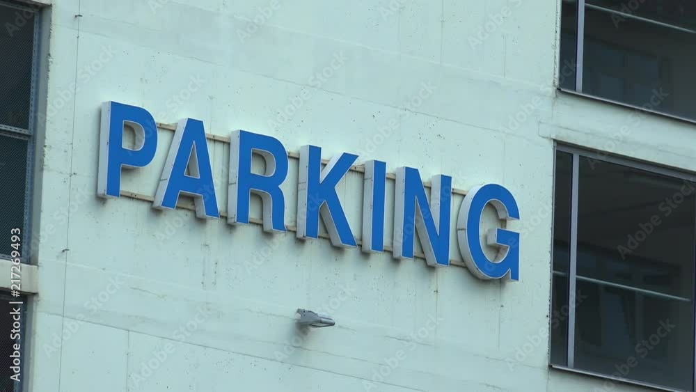 Closeup on a parking logo on a building wall Closeup on a parking logo on a building wall