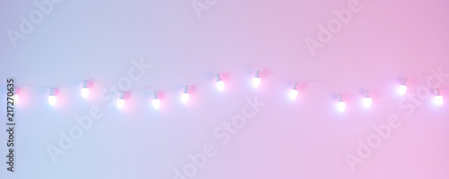Glowing light bulb on pastel color wall background. 3d rendering