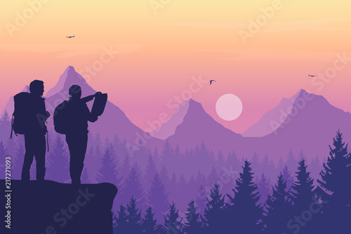 Two tourists  man and woman with backpacks standing and looking in a map on rock over mountain landscape with coniferous forest under purple sky with birds and sun
