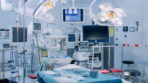 Establishing Shot of Technologically Advanced Operating Room with No People, Ready for Surgery. Real Modern Operating TheaterWith Working equipment,  Lights and Computers Ready for Surgeons