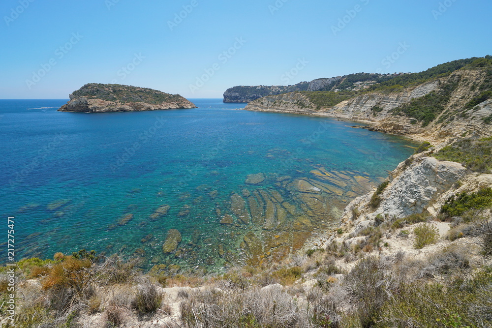 Spain Costa Blanca rocky coast with an island in Javea, Illa del Portitxol, Mediterranean sea, Alicante, Valencia