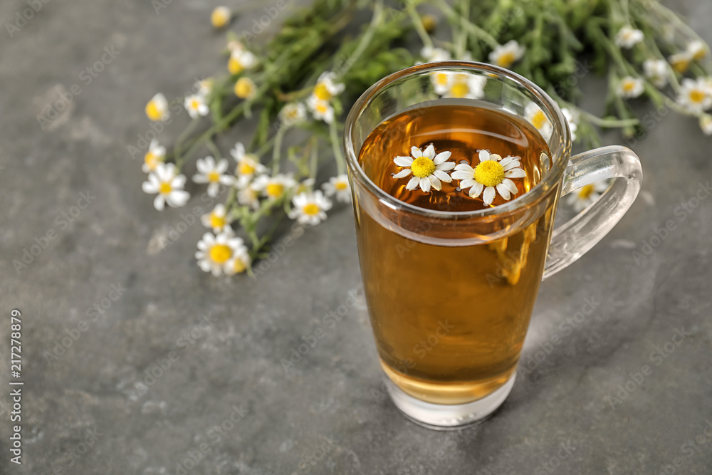 Cup of delicious camomile tea on table Cup of delicious camomile tea on table