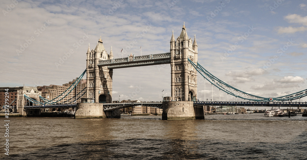 View fo Tower Bridge along with River Thames on a sunny day with cloudy sky in London. 
