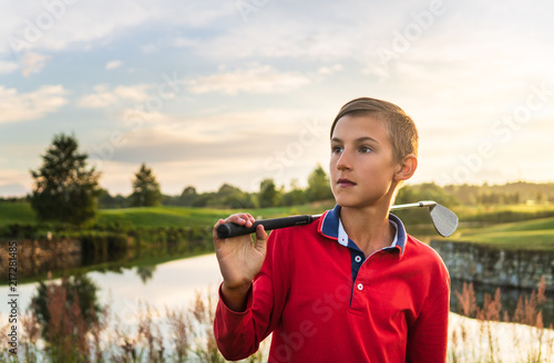 Boy playing golf photo
