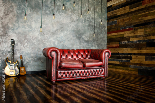 The divan is an honor of burgundy color in the interior. photo