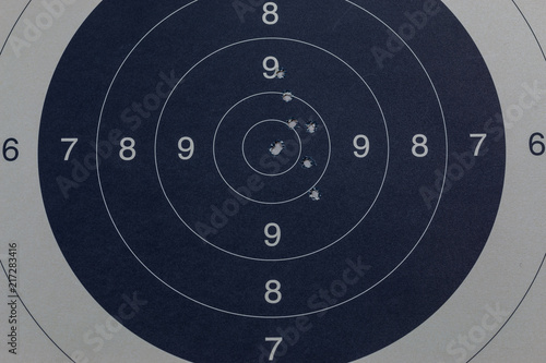 Bullet holes in the black target