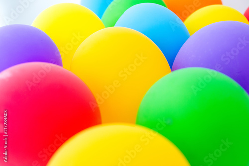 Background with plenty of colorful balloons arranged in heap in daylight
