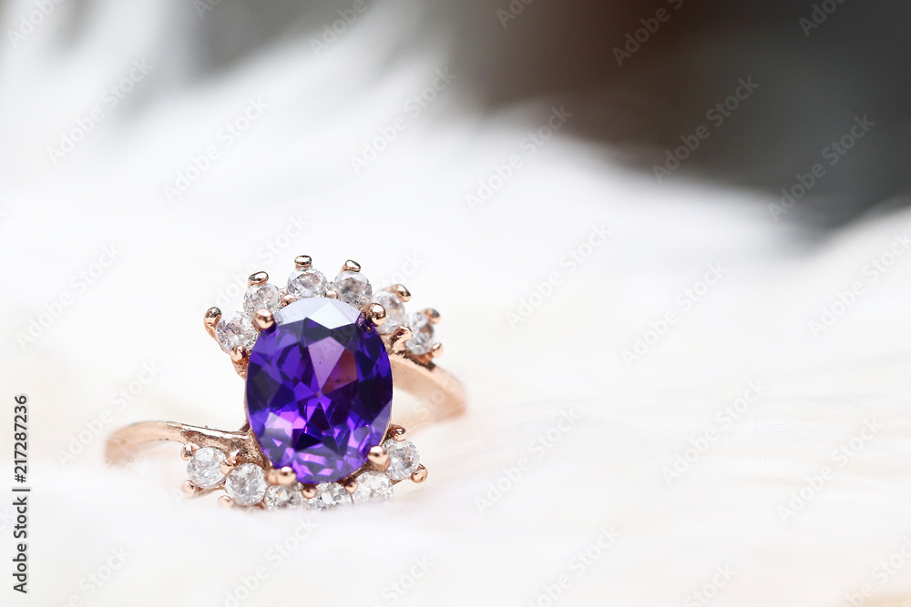 Purple gem stone on gold ring Purple gem stone on gold ring