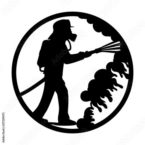 Fireman in a gas mask extinguishes a fire.