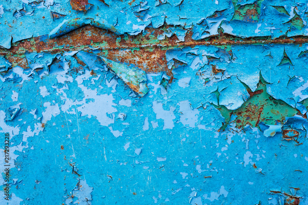 metal surface with peeling old blue paint