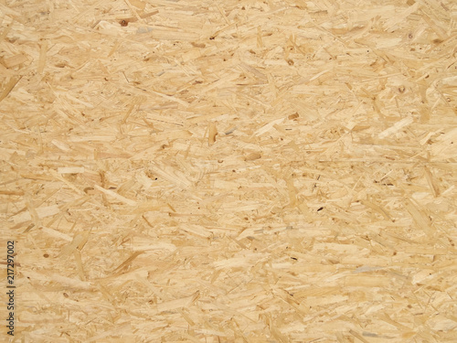 Pressed wooden panel background, seamless texture of oriented strand board - OSB