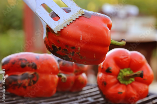 red bell paprika peppers on a grill, outdoor, barbecue, bbq time, vegan party photo