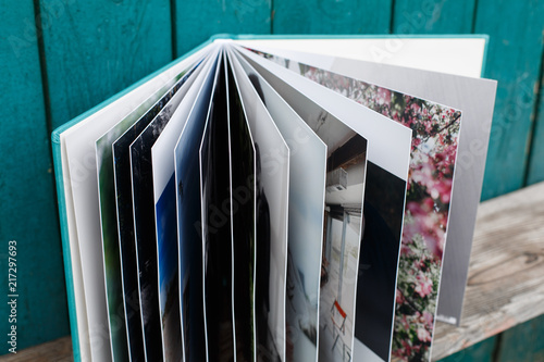 photobook with leather cover.
Photo book on a bright background.
wedding album.
Photo album on a wooden surface.
photobook pages
Expanded photo album. photo