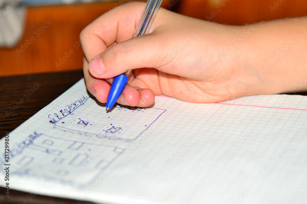 Children play sea-fight on paper. Children play sea-fight on paper.