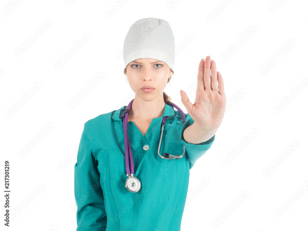 Young beautiful female doctor with stethoscope showing stop sign. Young beautiful female doctor with stethoscope showing stop sign.