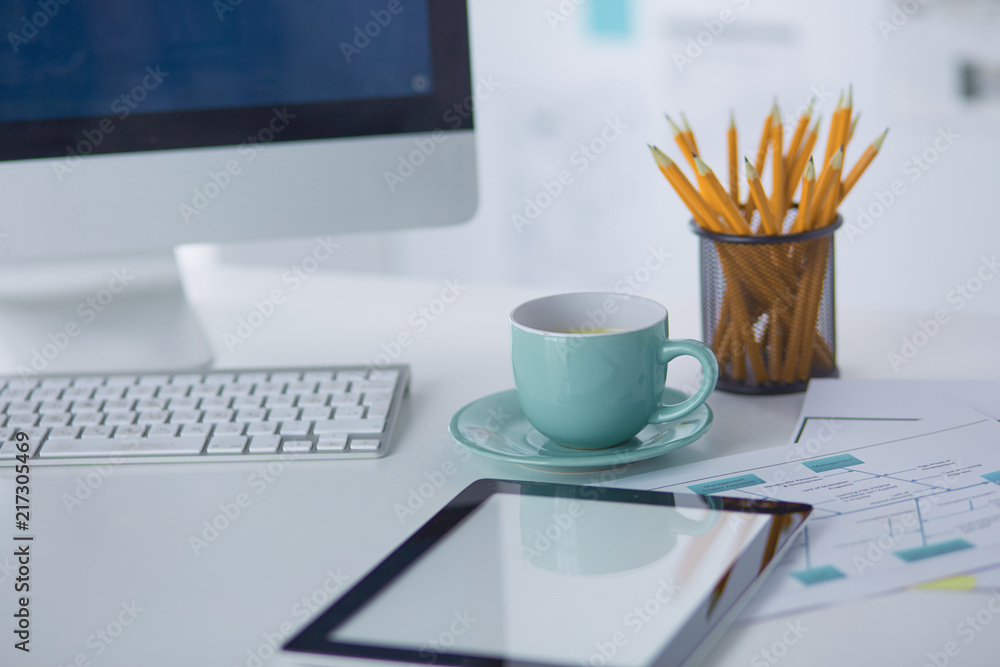 A cup of coffee on the office table A cup of coffee on the office table