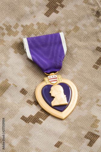 Purple Heart War Medal on Marine Camouflage Material photo