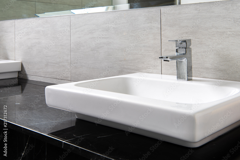 Fototapeta premium Bathroom interior with sink and faucet