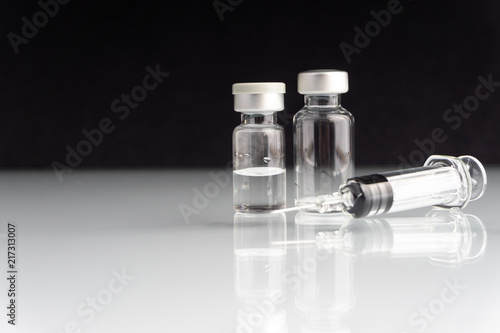 Syringe and vials closeup with selective focus and crop fragment. Medical and Healthcare Concept