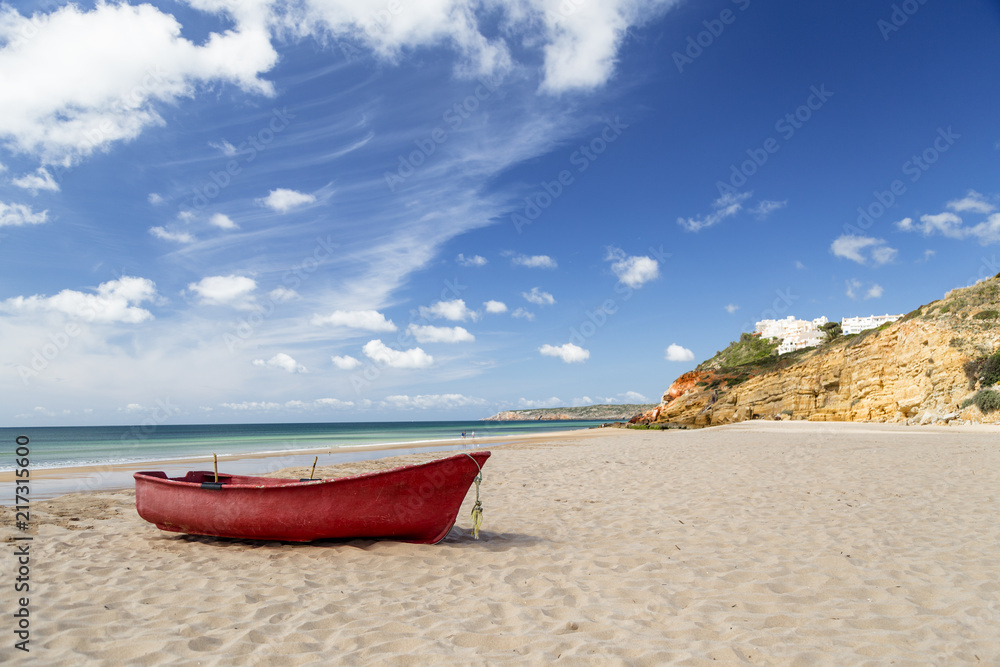 Red boat on paradise beach