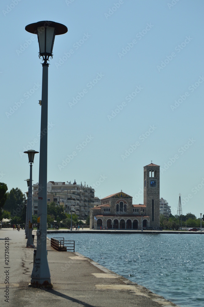Orthodox Church Of Konstantinos On Its Main Facade Photo Taken With The Sea In Between Enhancing Its Beauty. Architecture History Travel.4 July 2018. Volos. Magnesia. Greece.