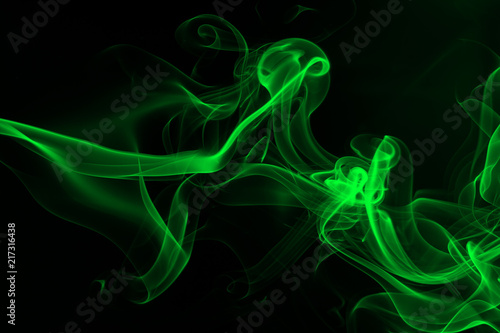 Green smoke on black background, darkness concept