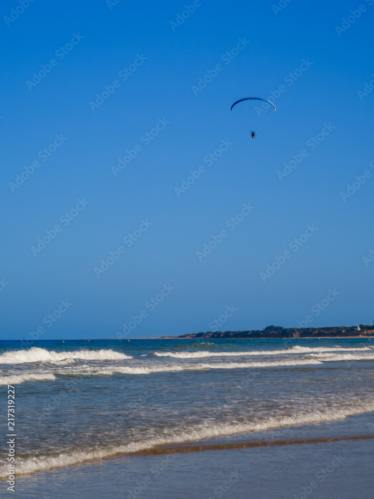 Paratrike flight on the beach of La Barrosa in Sancti Petri, Cádiz Paratrike flight on the beach of La Barrosa in Sancti Petri, Cádiz