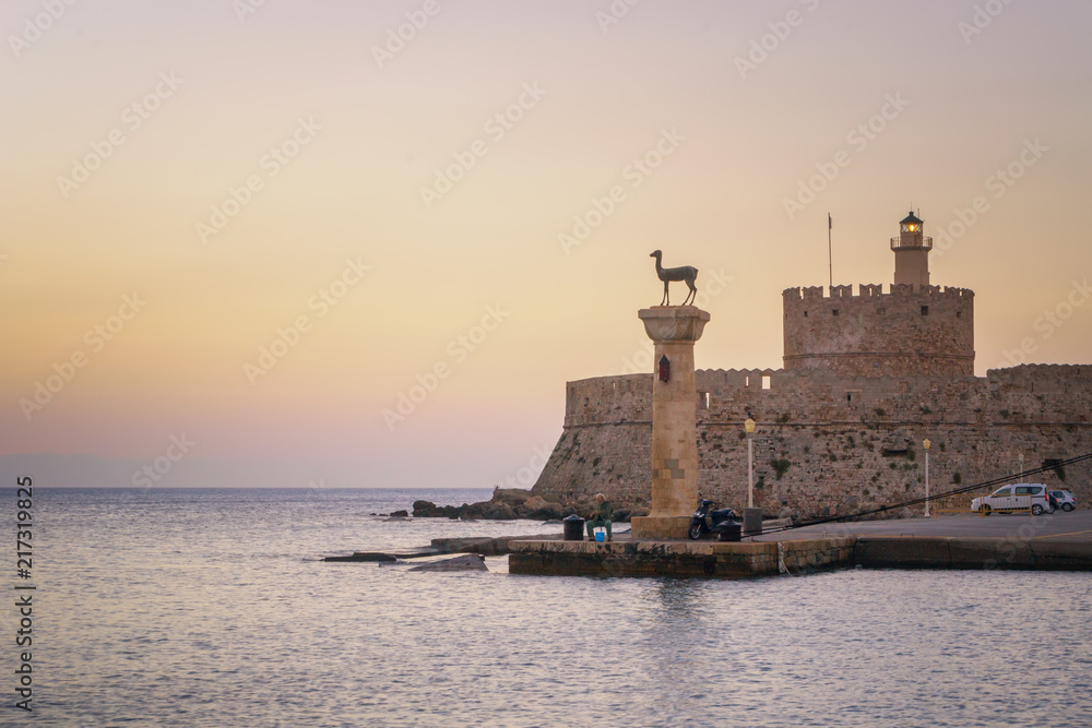 Entrance to Port of Rhodes at first sunlight - Greece. 