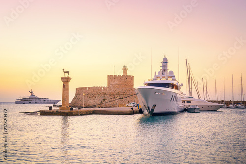 Entrance to Port of Rhodes at first sunlight - Greece. 