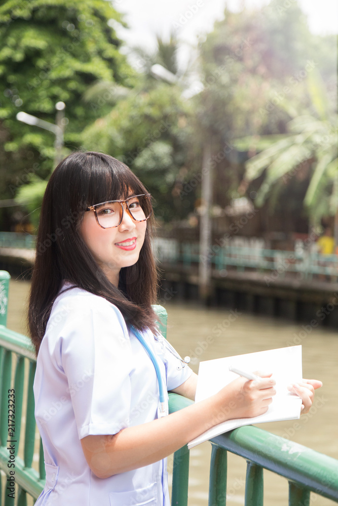 woman Asian doctor White Shirt suit with stethoscope outdoor Hospital. woman Asian doctor White Shirt suit with stethoscope outdoor Hospital.