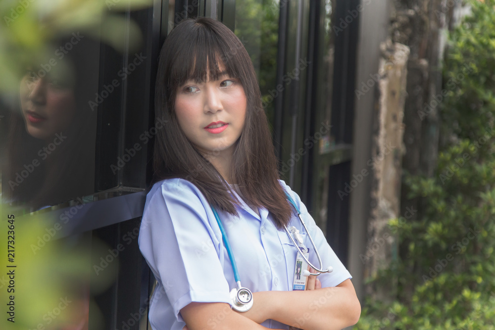 woman Asian doctor White Shirt suit with stethoscope outdoor Hospital. woman Asian doctor White Shirt suit with stethoscope outdoor Hospital.