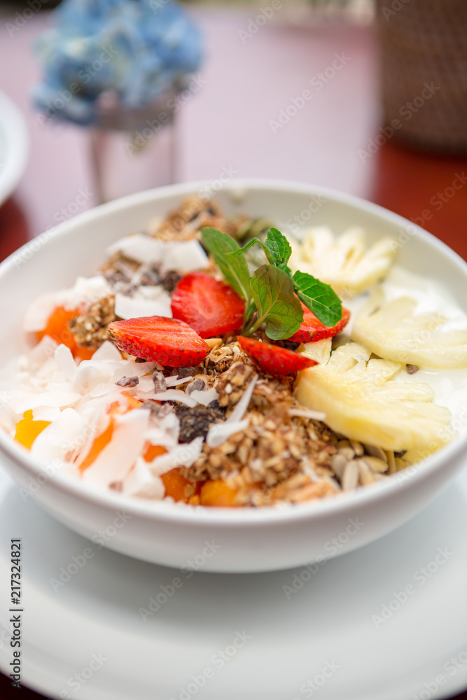 Tasty and healthy oatmeal porridge with fruit, berry, pineapple,strawberry and flax seeds. Healthy eating lifestyle concept. Health care and beauty. Healthy breakfast. Fitness food. Proper nutrition. Tasty and healthy oatmeal porridge with fruit, berry, pineapple,strawberry and flax seeds. Healthy eating lifestyle concept. Health care and beauty. Healthy breakfast. Fitness food. Proper nutrition.