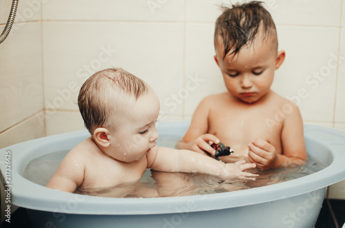 children, brother and sister in the bathroom photo